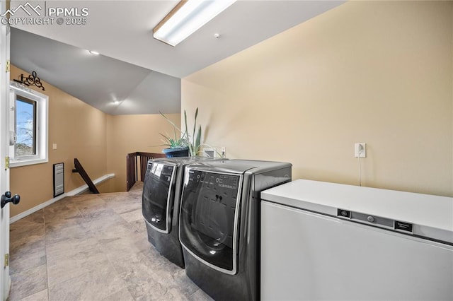 laundry room with washer and dryer