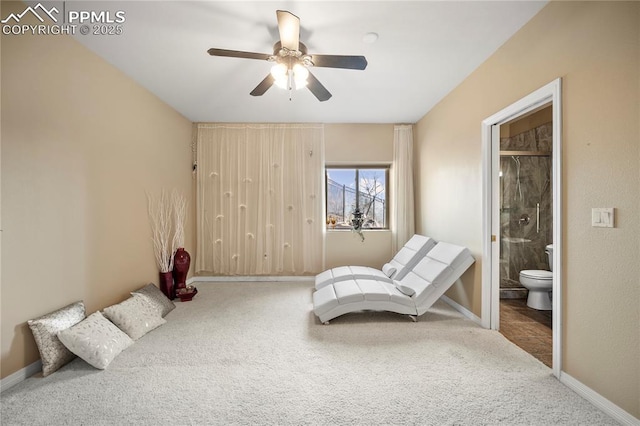 carpeted bedroom with ceiling fan and connected bathroom