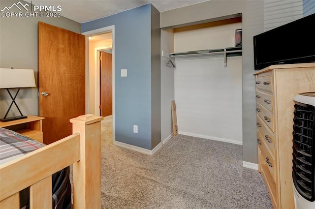 unfurnished bedroom with a closet and carpet flooring