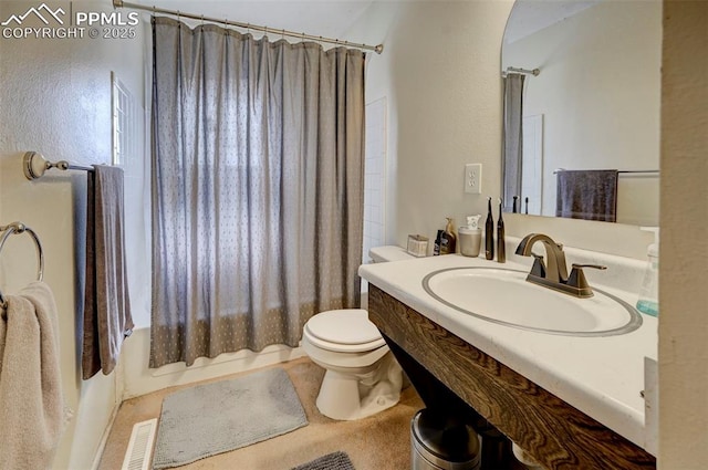 full bathroom with sink, toilet, and shower / bath combo with shower curtain