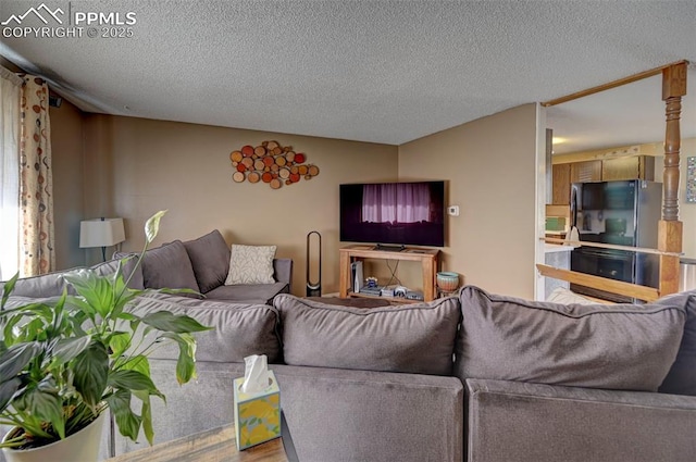 living room with a textured ceiling