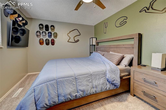 carpeted bedroom with ceiling fan, lofted ceiling, and a textured ceiling