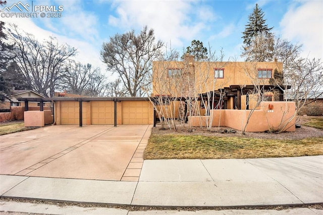 view of front of home featuring a garage and stucco siding