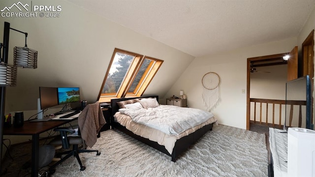 bedroom featuring lofted ceiling and carpet flooring