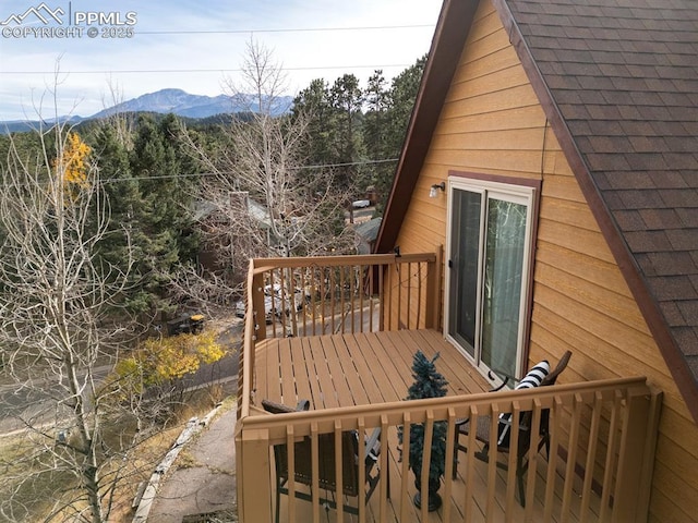 wooden deck with a mountain view