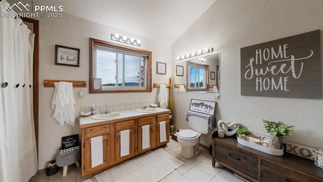 bathroom featuring a healthy amount of sunlight, toilet, and tile patterned flooring