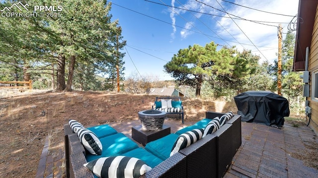 view of patio featuring outdoor lounge area and a grill