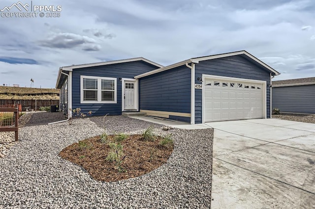 ranch-style home featuring a garage