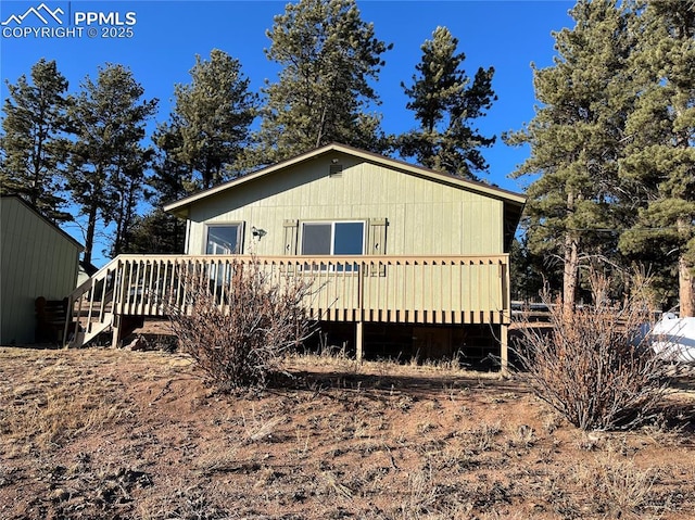 rear view of house featuring a deck