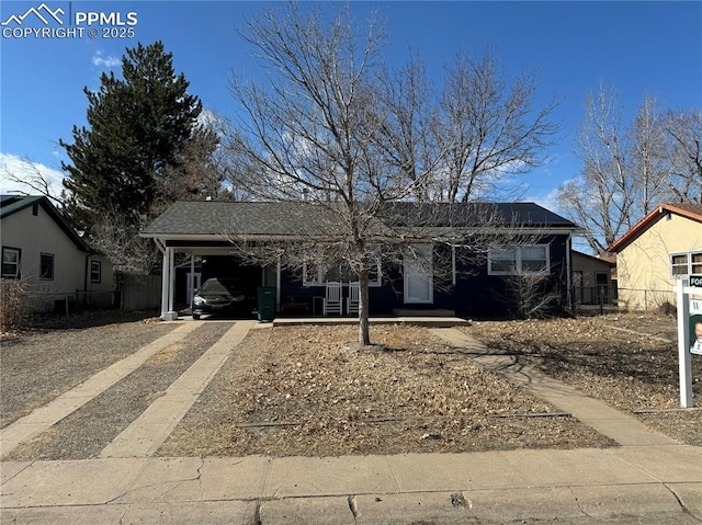 ranch-style house with a carport