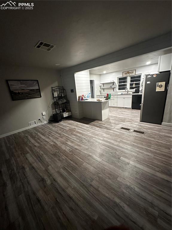 unfurnished living room featuring hardwood / wood-style floors