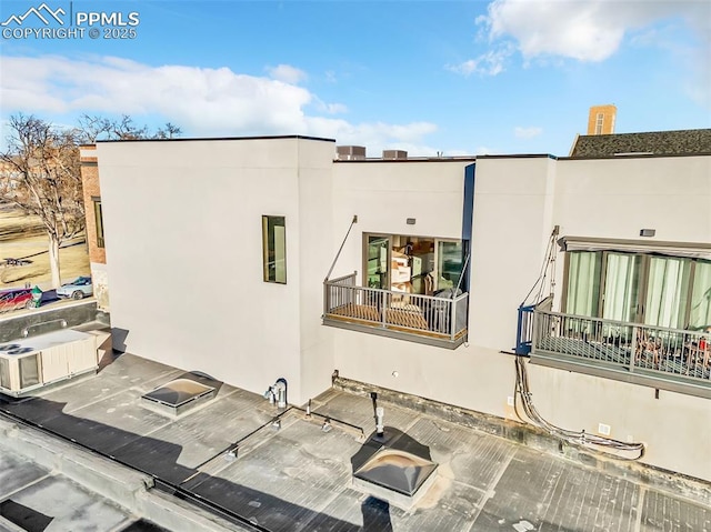 117 E Bijou St Unit 202, Colorado Springs, CO 80903 - back of property featuring stucco siding