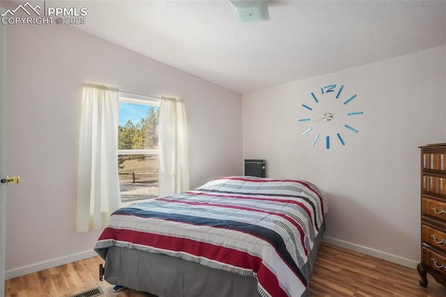 bedroom featuring hardwood / wood-style floors