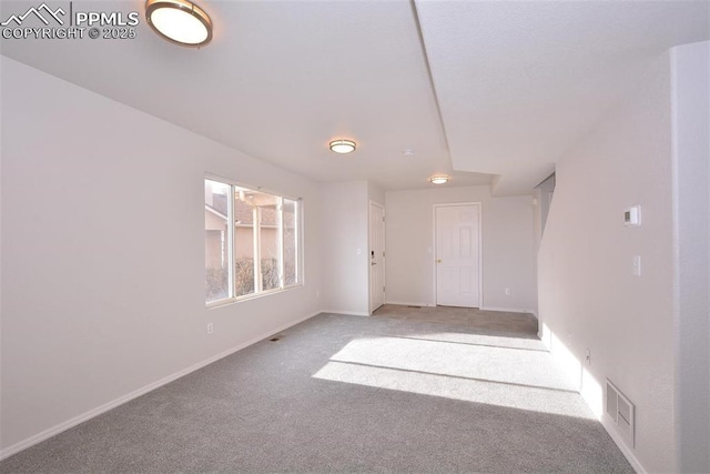 unfurnished room featuring carpet