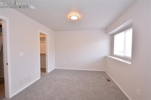 unfurnished room featuring carpet floors