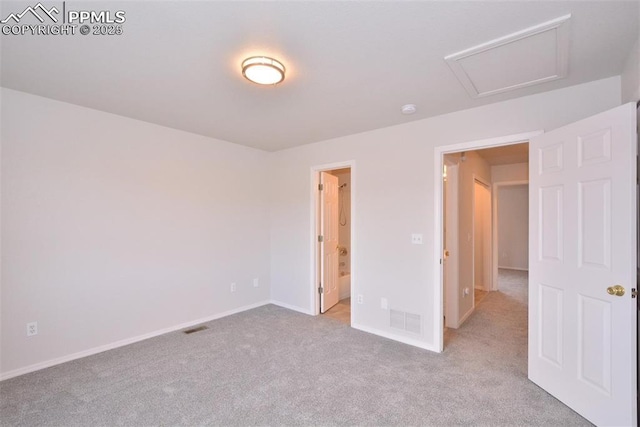 unfurnished bedroom with light colored carpet