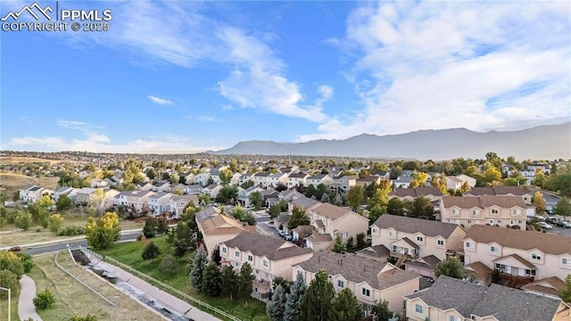 birds eye view of property featuring a mountain view