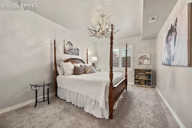 bedroom with carpet floors and a notable chandelier