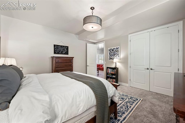 carpeted bedroom with a closet