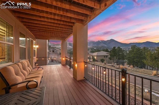 deck at dusk with a mountain view