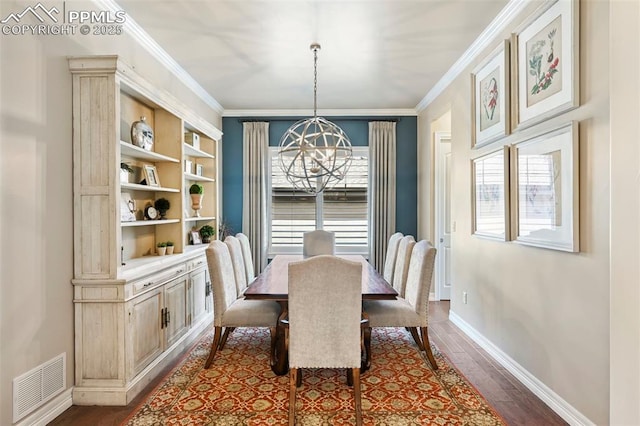 dining area with an inviting chandelier, hardwood / wood-style flooring, and ornamental molding