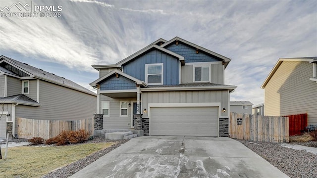 craftsman house featuring a garage and a front lawn