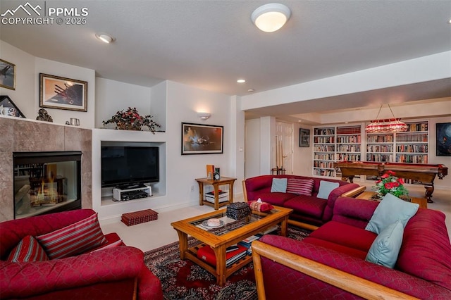 living room featuring a tile fireplace