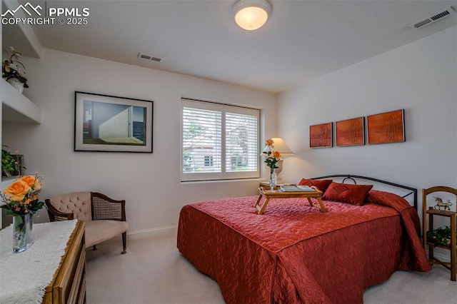 bedroom with light colored carpet