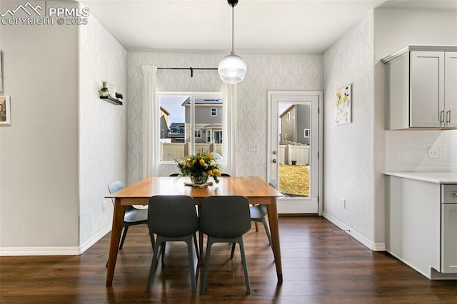 dining area featuring dark hardwood / wood-style floors