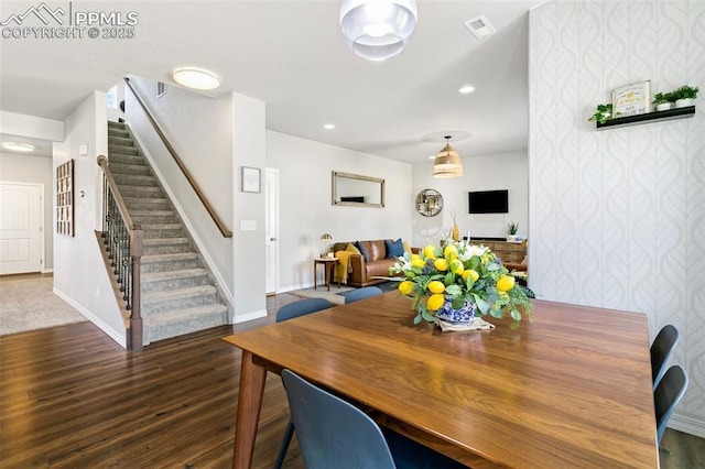 dining space featuring dark wood-type flooring