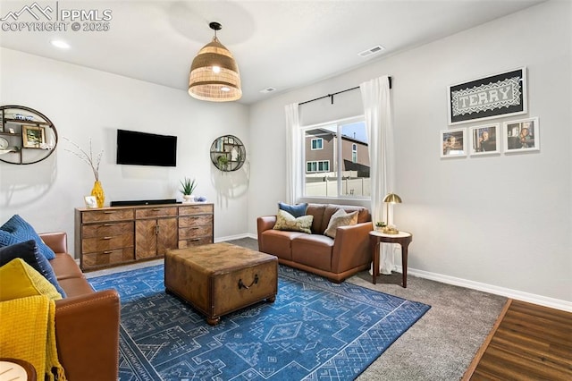 living room featuring dark hardwood / wood-style flooring