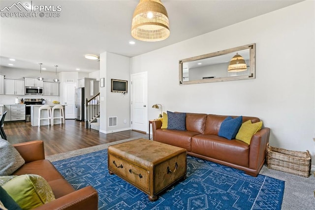 living room featuring dark hardwood / wood-style floors