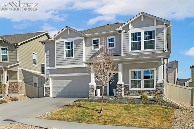 craftsman inspired home with a garage, a front lawn, and a porch