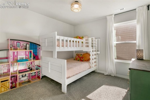 bedroom featuring dark carpet