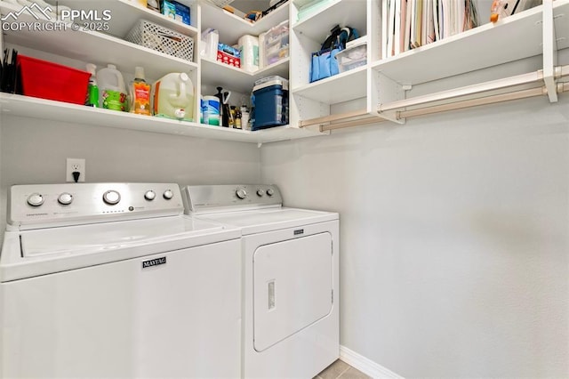 washroom with washing machine and dryer