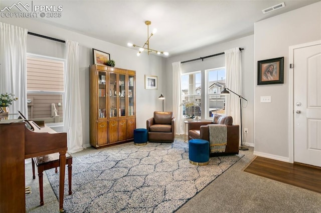 living area with a notable chandelier