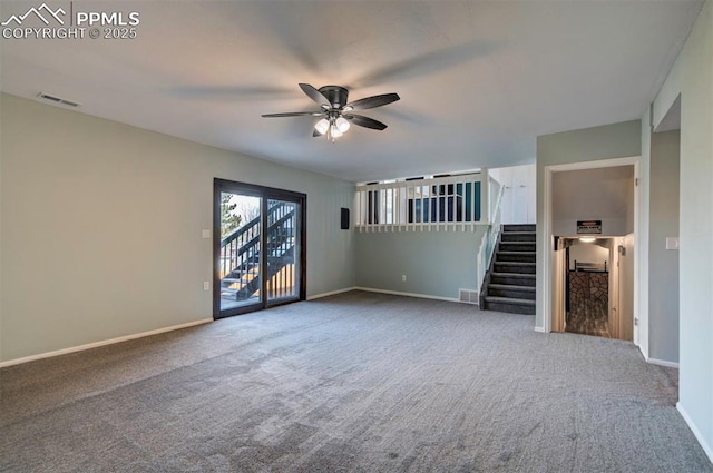 unfurnished living room featuring carpet floors and ceiling fan