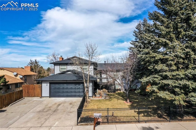 view of front of house with a garage and a front yard