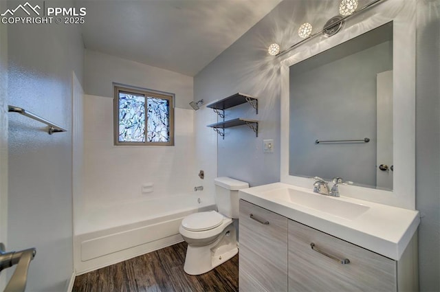 full bathroom featuring vanity, wood-type flooring,  shower combination, and toilet