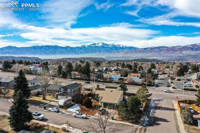 birds eye view of property featuring a mountain view