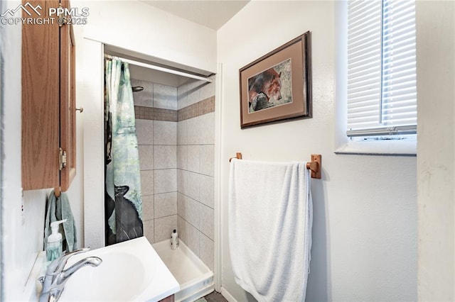 bathroom featuring sink and walk in shower