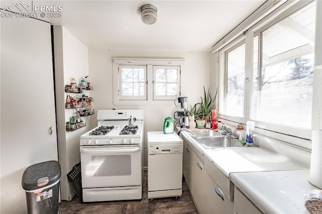 kitchen featuring white appliances and sink