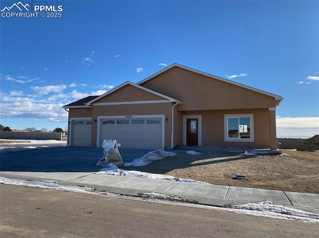 view of front of property with a garage