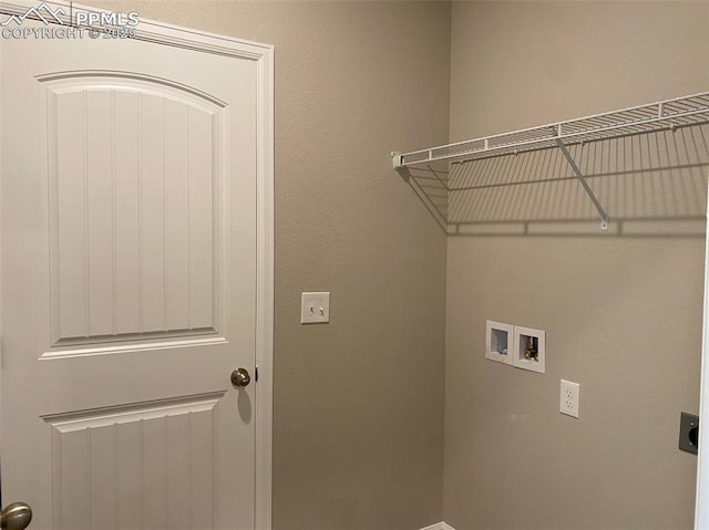 clothes washing area with hookup for an electric dryer and hookup for a washing machine