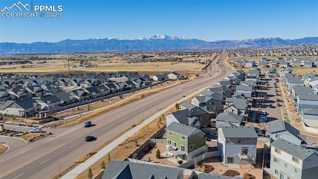 birds eye view of property with a mountain view