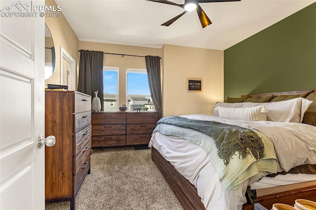 bedroom featuring ceiling fan and carpet floors