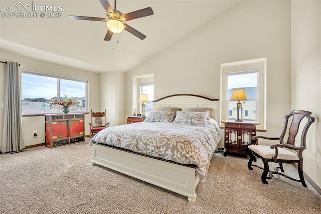 carpeted bedroom with high vaulted ceiling and ceiling fan