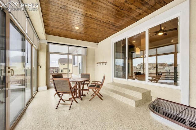 sunroom / solarium featuring wood ceiling