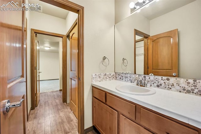 bathroom featuring vanity and hardwood / wood-style flooring