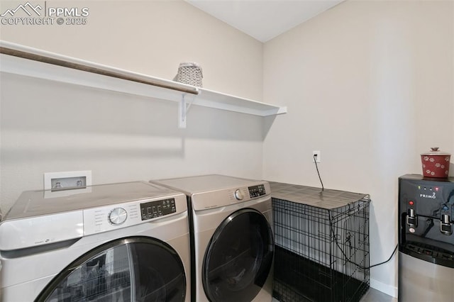 laundry room with washing machine and clothes dryer